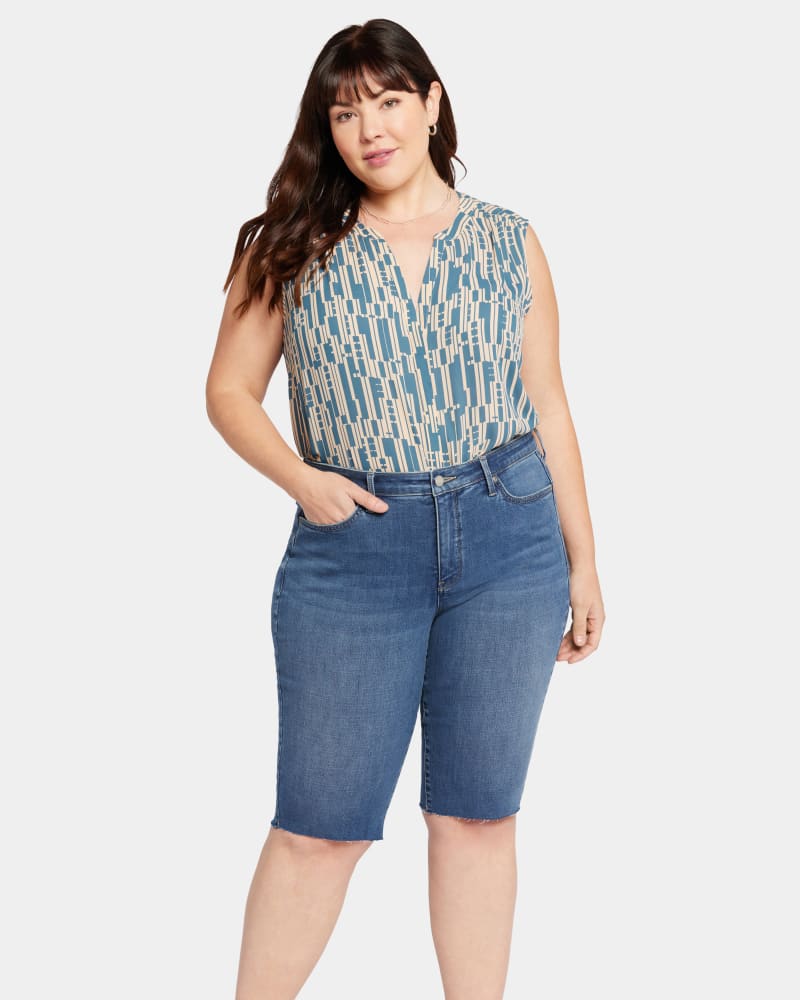 Front of a model wearing a size 24W BIKE CAPRI RAW CUT HEMS in AWAKENING by NYDJ. | dia_product_style_image_id:295284